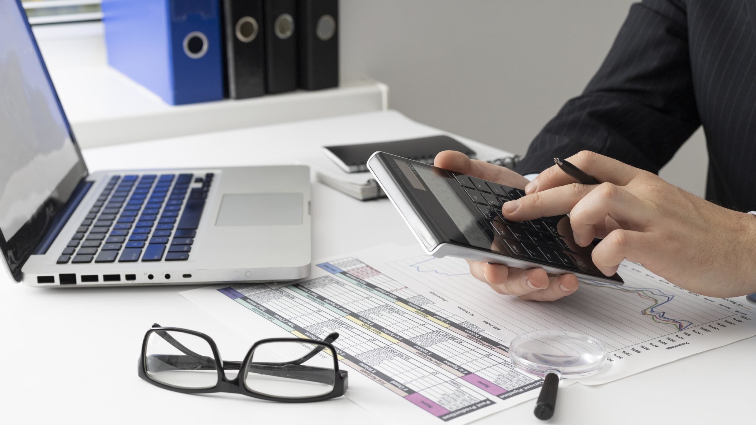 side-view-business-man-calculating-finance-numbers side-view-business-man-calculating-finance-numbers